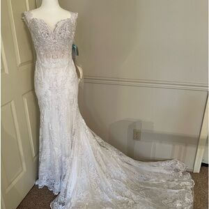 Brand New Beautiful wedding dress with tags.